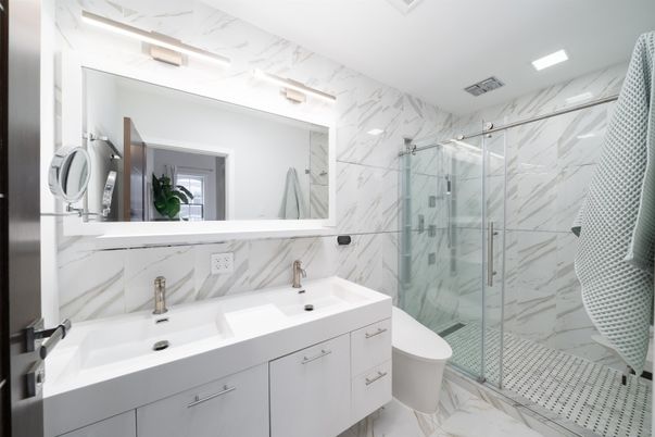 Bathroom, Dual Sink Vanities, Glass Shower, Interior, Marble, Marble Walls, Recessed Lighting