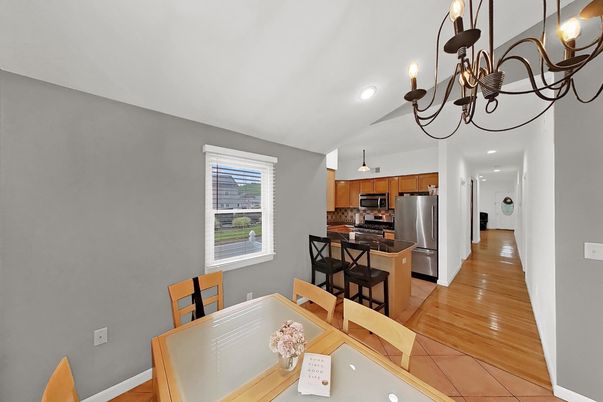 Chandelier, Dining room, Interior, Kitchen, Recessed Lighting, Stainless Steel Appliances, Wood Texture Flooring