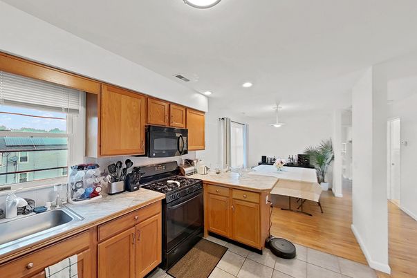 Dining room, Interior, Kitchen, Pendant Lights, Recessed Lighting, Tile Countertops, Water, Wood Texture Flooring