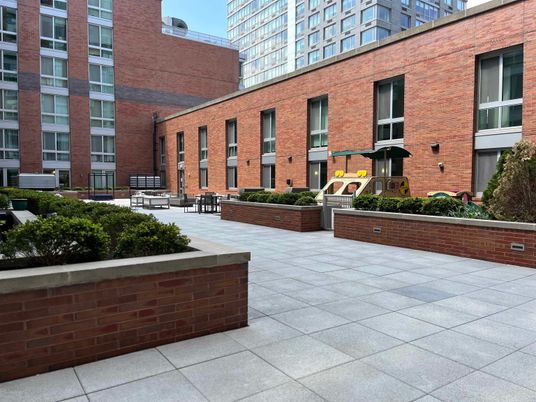 Exterior, Facade, Brick Facade, Condo Building