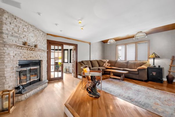 Fireplace, Interior, Living room, Recessed Lighting, Stone Walls, Wood Texture Flooring