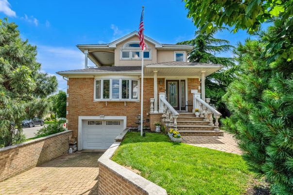 Attached, Exterior, Facade, Brick Facade, American Foursquare