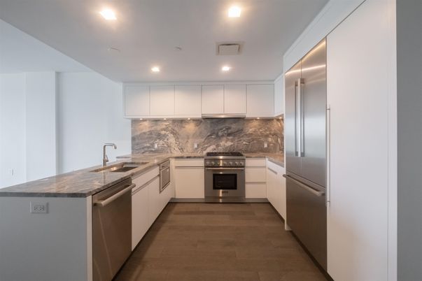 Interior, Kitchen, Marble Walls, Recessed Lighting, Stainless Steel Appliances, Wood Texture Flooring