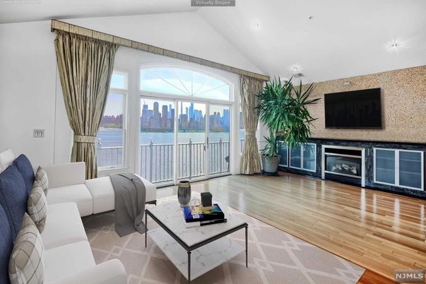 Fireplace, Interior, Living room, Recessed Lighting, Water, Wood Texture Flooring
