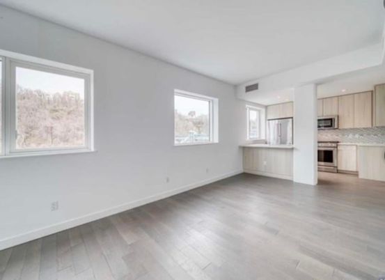 Empty room, Interior, Kitchen, Recessed Lighting, Stainless Steel Appliances, Wood Texture Flooring