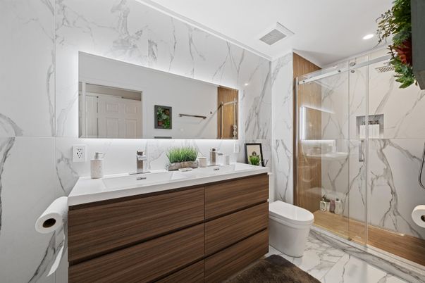 Bathroom, Dual Sink Vanities, Glass Shower, Interior, Marble, Marble Walls, Recessed Lighting