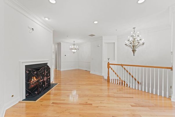 Chandelier, Empty room, Fireplace, Interior, Recessed Lighting, Wood Texture Flooring