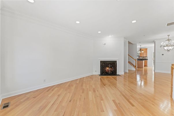 Chandelier, Empty room, Fireplace, Interior, Recessed Lighting, Wood Texture Flooring