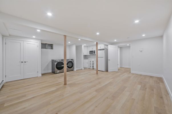 Empty room, Interior, Kitchen, Recessed Lighting, Washer, Wood Texture Flooring
