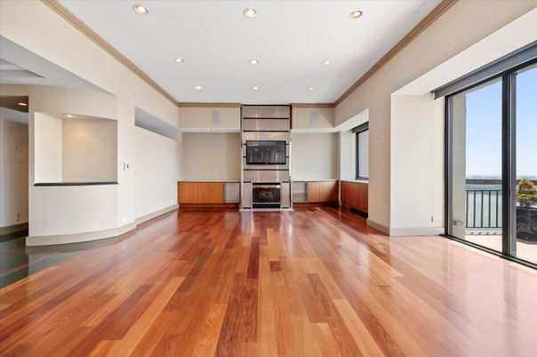 Empty room, Fireplace, Interior, Recessed Lighting, Stainless Steel Appliances, Wood Texture Flooring