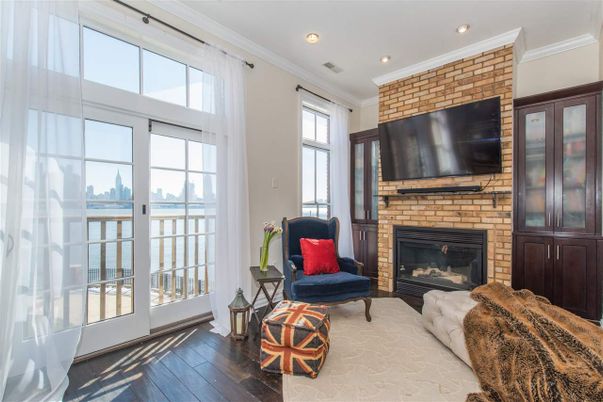 Fireplace, Interior, Living room, Recessed Lighting, Stone Walls, Wood Texture Flooring