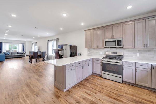 Dining room, Interior, Kitchen, Living room, Recessed Lighting, Stainless Steel Appliances, Wood Texture Flooring