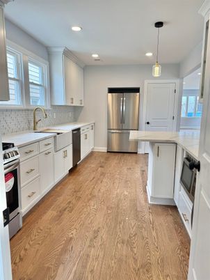Interior, Kitchen, Pendant Lights, Recessed Lighting, Stainless Steel Appliances, Wood Texture Flooring