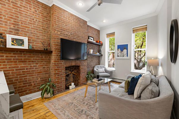 Fireplace, Interior, Living room, Recessed Lighting, Stone Walls, Wood Texture Flooring