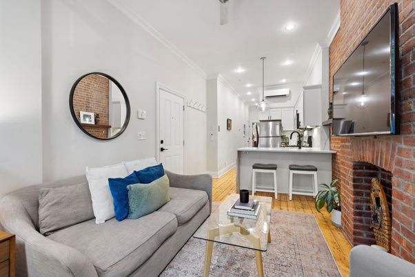 Fireplace, Interior, Kitchen, Living room, Pendant Lights, Recessed Lighting, Stainless Steel Appliances, Stone Walls, Wood Texture Flooring