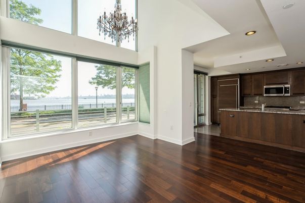 Chandelier, Empty room, Interior, Kitchen, Recessed Lighting, Stainless Steel Appliances, Wood Texture Flooring