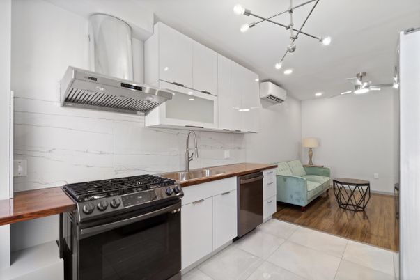 Interior, Kitchen, Marble Walls, Pendant Lights, Recessed Lighting, Stainless Steel Appliances, Wood Texture Flooring
