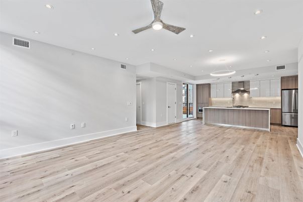 Empty room, Interior, Kitchen, Pendant Lights, Recessed Lighting, Stainless Steel Appliances, Wood Texture Flooring