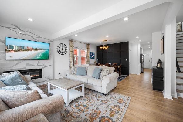Dining room, Fireplace, Interior, Living room, Marble Walls, Pendant Lights, Recessed Lighting, Wood Texture Flooring