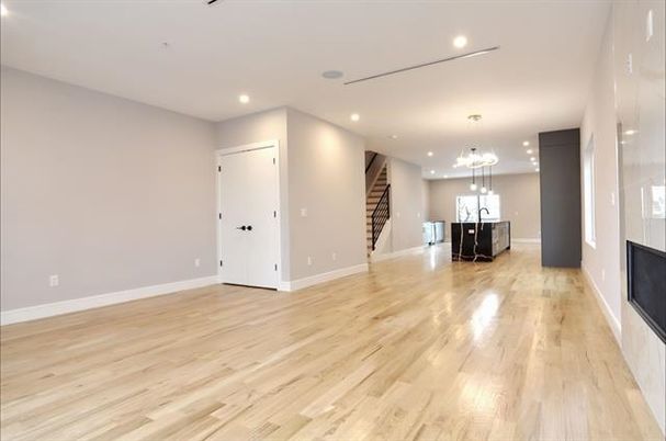 Empty room, Fireplace, Interior, Pendant Lights, Recessed Lighting, Wood Texture Flooring