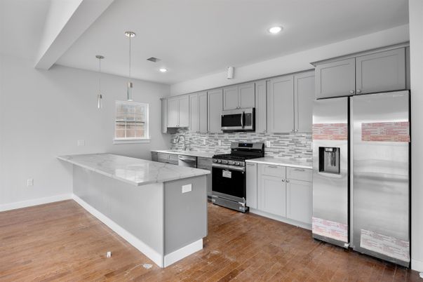 Interior, Kitchen, Pendant Lights, Recessed Lighting, Stainless Steel Appliances, Wood Texture Flooring