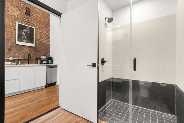 Bathroom, Glass Shower, Interior, Recessed Lighting, Stone Walls, Wood Texture Flooring