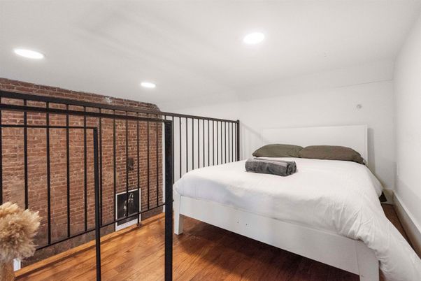 Bedroom, Fireplace, Interior, Recessed Lighting, Wood Texture Flooring