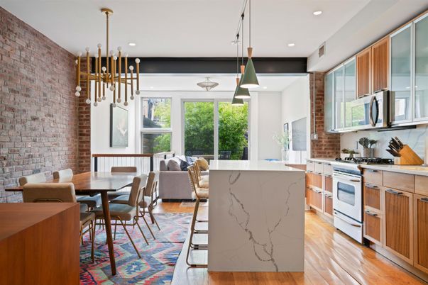 Dining room, Interior, Kitchen, Living room, Pendant Lights, Recessed Lighting, Stainless Steel Appliances, Stone Walls, Wood Texture Flooring
