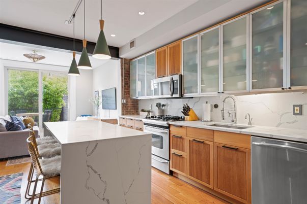 Interior, Kitchen, Marble Walls, Pendant Lights, Recessed Lighting, Stainless Steel Appliances, Wood Texture Flooring