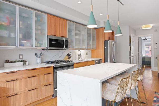 Interior, Kitchen, Marble Walls, Pendant Lights, Recessed Lighting, Stainless Steel Appliances, Wood Texture Flooring