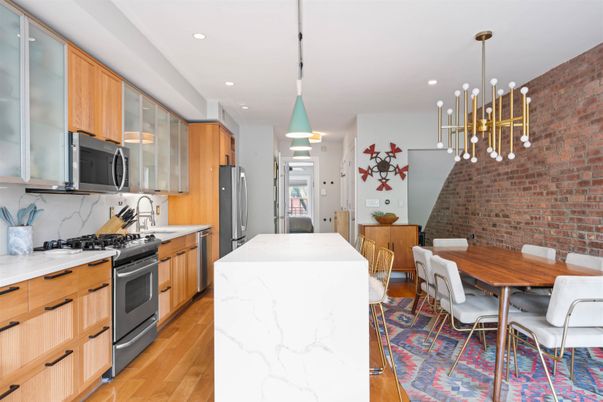 Dining room, Interior, Kitchen, Pendant Lights, Recessed Lighting, Stainless Steel Appliances, Stone Walls, Wood Texture Flooring