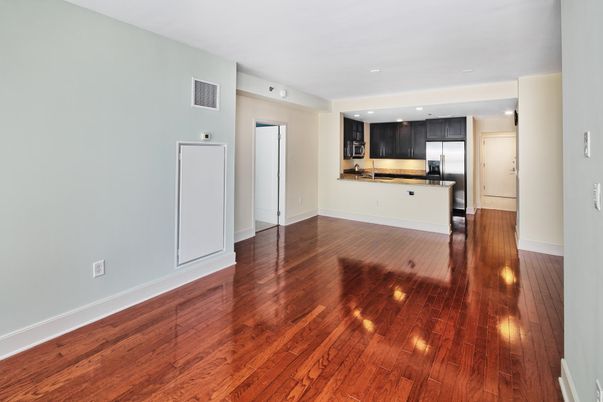 Empty room, Interior, Kitchen, Recessed Lighting, Stainless Steel Appliances, Wood Texture Flooring