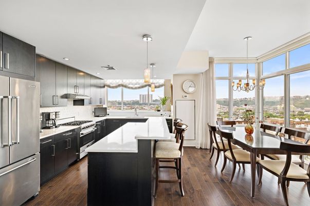 Chandelier, Dining room, Interior, Kitchen, Pendant Lights, Recessed Lighting, Stainless Steel Appliances, Wood Texture Flooring