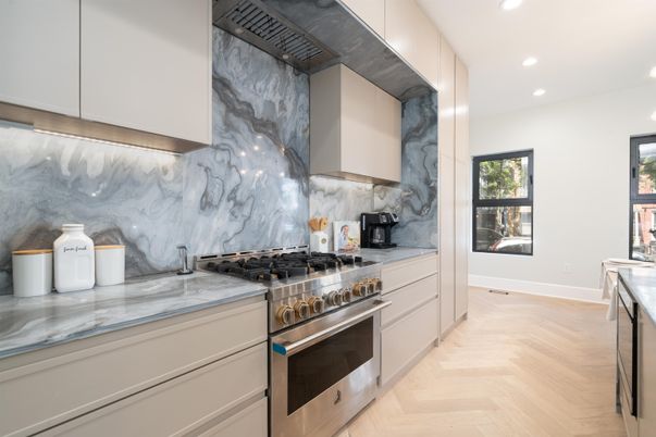 Interior, Kitchen, Marble Walls, Recessed Lighting, Stainless Steel Appliances, Wood Texture Flooring