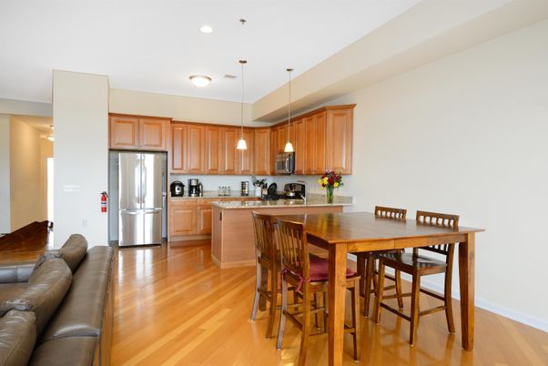 Dining room, Interior, Kitchen, Pendant Lights, Recessed Lighting, Stainless Steel Appliances, Wood Texture Flooring