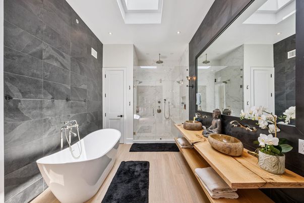 Bathroom, Dual Sink Vanities, Free Standing Baths, Glass Shower, Interior, Marble Walls, Recessed Lighting, Wood Texture Flooring