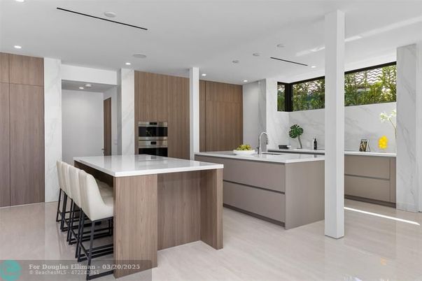 Interior, Kitchen, Marble Walls, Recessed Lighting, Stainless Steel Appliances