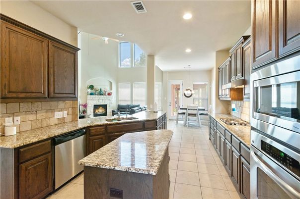 Dining room, Fireplace, Interior, Kitchen, Living room, Pendant Lights, Recessed Lighting, Stainless Steel Appliances