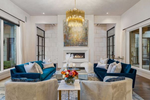 Chandelier, Fireplace, Interior, Living room, Recessed Lighting, Stone Walls, Wood Texture Flooring