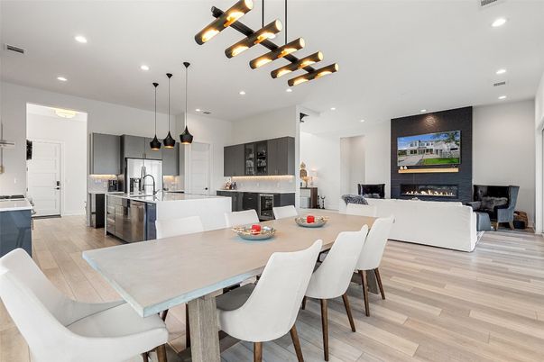 Dining room, Fireplace, Interior, Kitchen, Living room, Pendant Lights, Recessed Lighting, Stainless Steel Appliances, Wood Texture Flooring