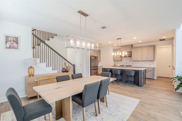 Dining room, Interior, Kitchen, Pendant Lights, Recessed Lighting, Stainless Steel Appliances, Wood Texture Flooring