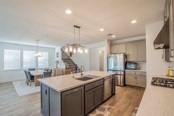 Chandelier, Dining room, Interior, Kitchen, Pendant Lights, Recessed Lighting, Stainless Steel Appliances, Wood Texture Flooring