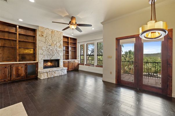 Fireplace, Interior, Kitchen, Pendant Lights, Recessed Lighting, Stainless Steel Appliances, Stone Walls, Wood Texture Flooring
