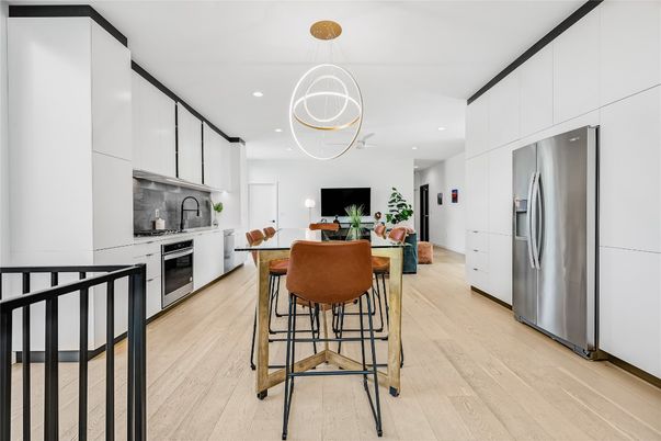 Dining room, Interior, Kitchen, Pendant Lights, Recessed Lighting, Stainless Steel Appliances, Wood Texture Flooring
