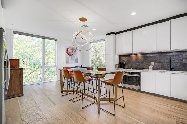 Dining room, Interior, Kitchen, Pendant Lights, Recessed Lighting, Stainless Steel Appliances, Wood Texture Flooring