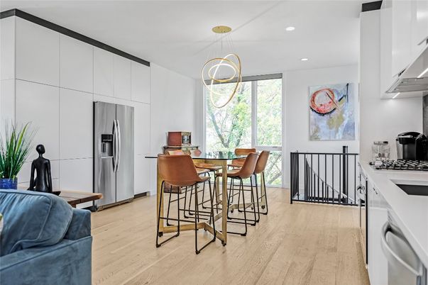 Dining room, Interior, Kitchen, Pendant Lights, Recessed Lighting, Stainless Steel Appliances, Wood Texture Flooring