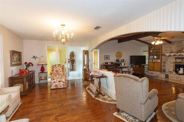 Chandelier, Fireplace, Interior, Living room, Stone Walls, Wooden Beams, Wood Texture Flooring