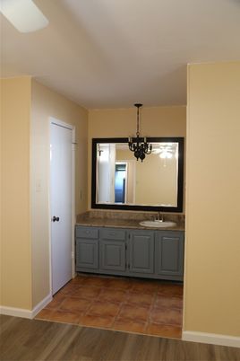 Bathroom, Chandelier, Dual Sink Vanities, Interior, Wood Texture Flooring