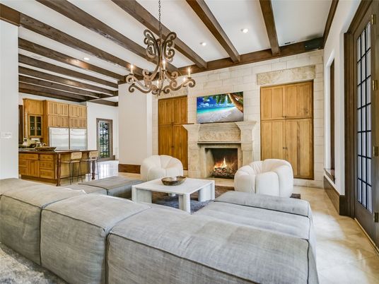 Chandelier, Fireplace, Interior, Living room, Recessed Lighting, Stone Walls, Wooden Beams