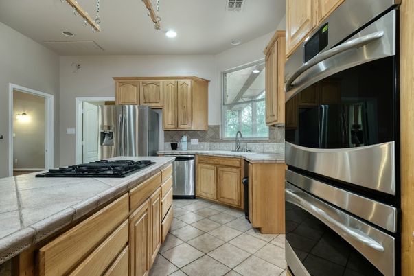 Interior, Kitchen, Recessed Lighting, Stainless Steel Appliances, Tile Countertops
